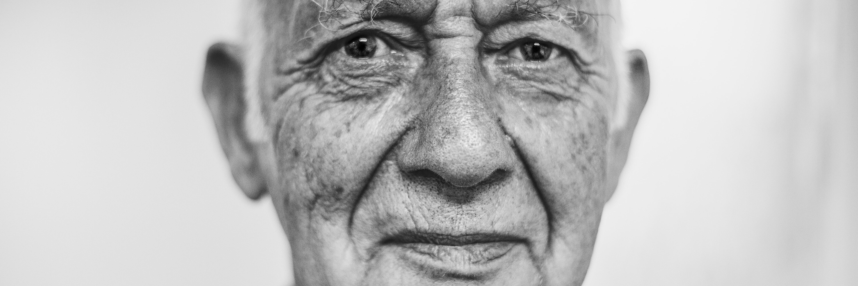 PTSD Gives Me Racing Thoughts older man looking at camera