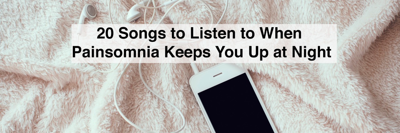 White smartphone with a headphones on crumpled soft beige blanket and text 20 songs to listen to when painsomnia keeps you up at night
