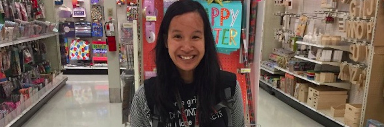 Sensory Processing Disorder and 'Tunnel Vision Effect': My Experience Sara with her service dog Rufus in front of a store aisle