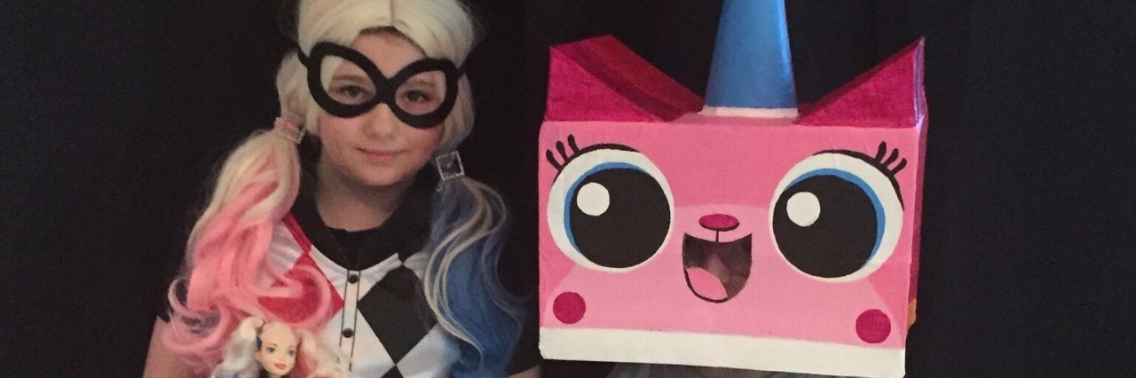How Children Benefit From Having a Parent With Chronic Pain two children dressed as harley quinn and unikitty