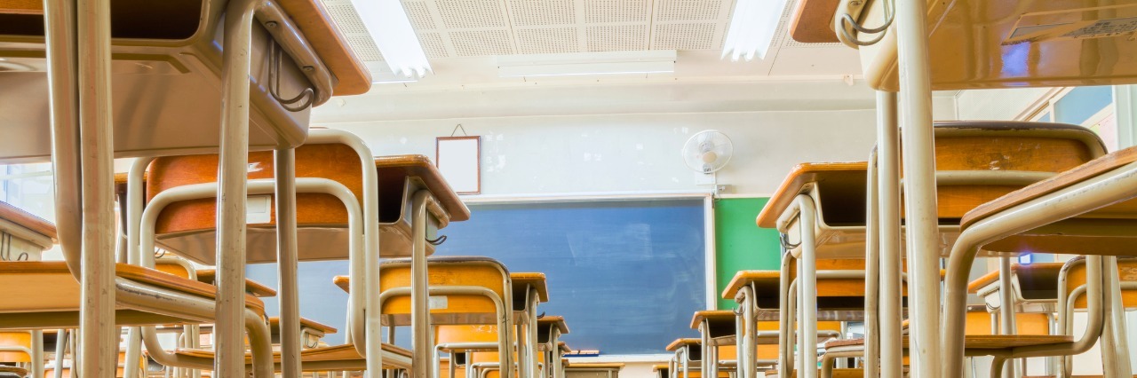Thank You Letter to Boy Who Didn't Judge Me for My Self-Harm Scars A Japanese classroom with desk and tables and blakckboard is taken from low angle.