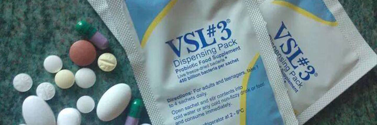 Why Donating for Research and a Cure for IBD Is Important pills and packets of medication on table
