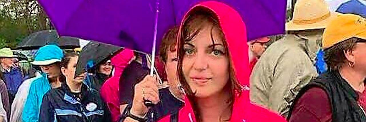 Is It OK to Ask Someone About Their Diagnosis? woman holding protest sign