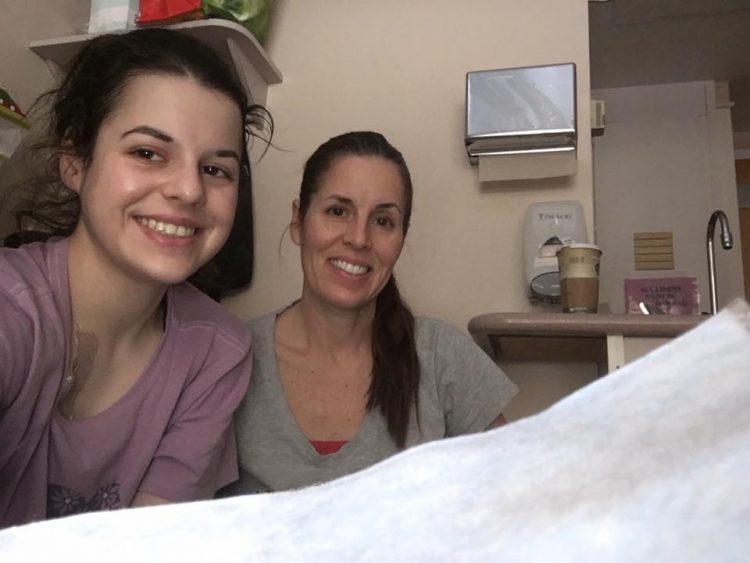 teenage girl and mom in hospital room