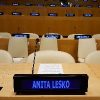 UN tables and chairs with a digital nameplate reading Anita Lesko and digital name plates on tables in the background that say Autism Day 2017
