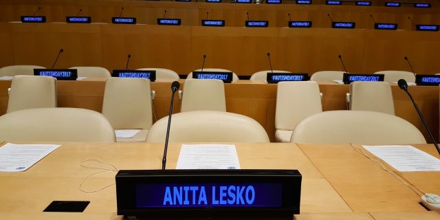 What I Learned at the United Nations on World Autism Awareness Day UN tables and chairs with a digital nameplate reading Anita Lesko and digital name plates on tables in the background that say Autism Day 2017