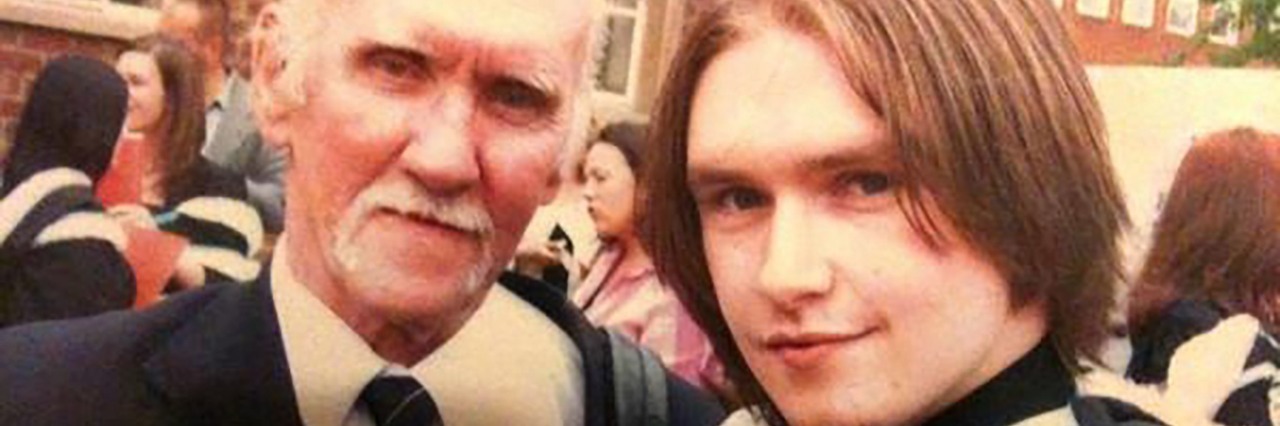 Why I Haven't Begun to Grieve, Even Years After My Father's Death elderly man wearing suit with 21-year-old son wearing university graduation robes and smiling