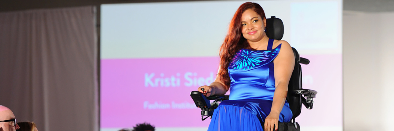 Design for Disability Web Series to Promote Inclusive Fashion A model in blue dress using a power wheelchair.