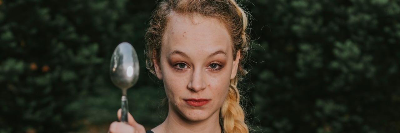 Resilient: My Chronic Illness Photo Shoot woman holding a spoon