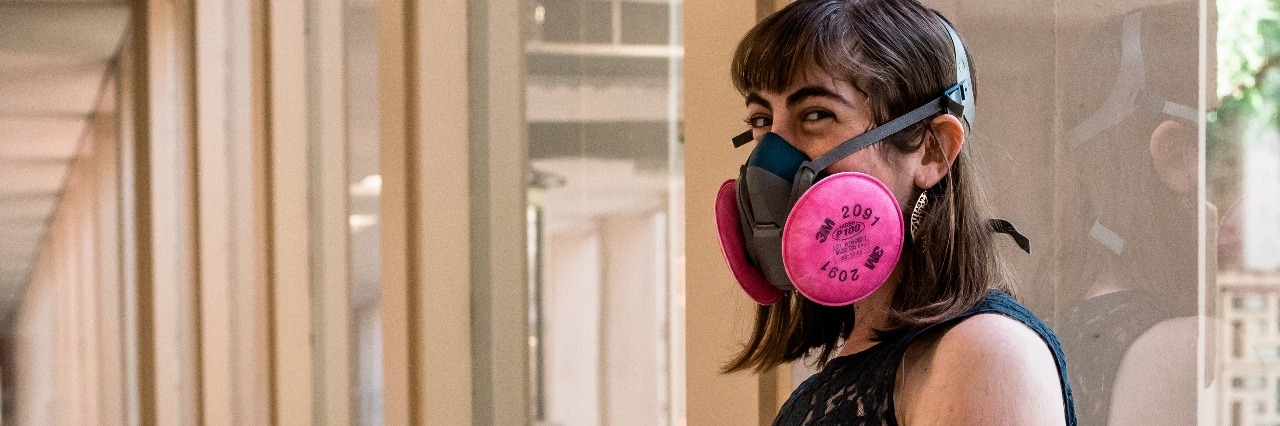 Facing Organ Rejection After Heart-Lung Transplant woman wearing a face mask doing wall squats after receiving an infusion