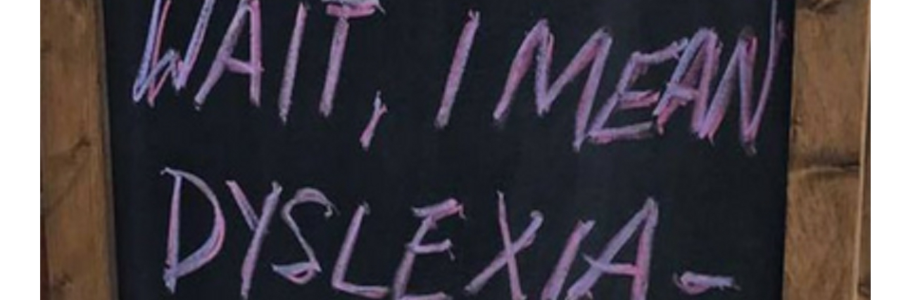 Local Tap Bar and Grill Upsets People With Dyslexia Joke Bar Sign Sign which reads "wait, I mean dyslexia"