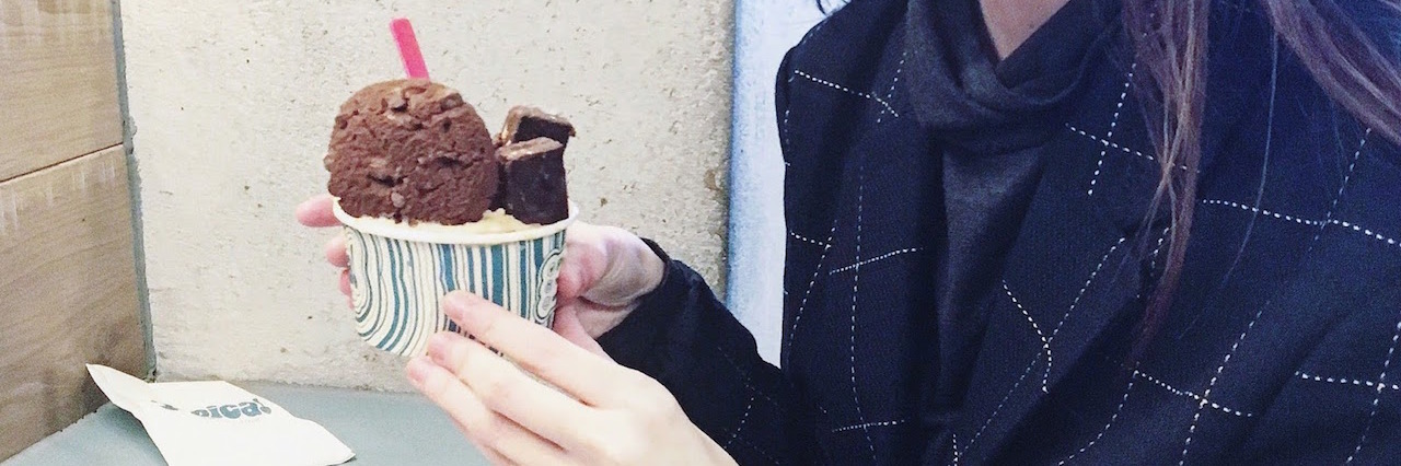 A Letter to My Anorexia the author holding a cup of ice cream