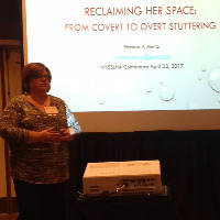Pamela speaking at a conference.