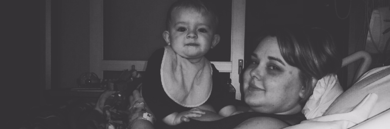 4 Lessons My Son Has Learned by Having a Mom With a Chronic Illness A mother and son in a hospital bed.