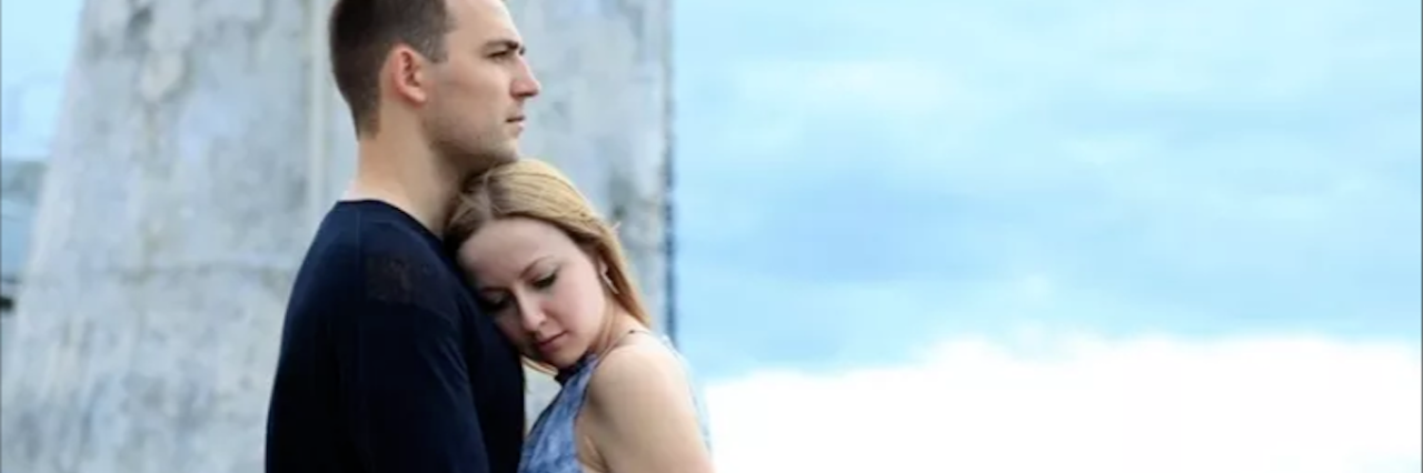 Lyme Disease: Maintaining a Healthy Relationship When You're Ill man and woman holding each other and standing outside