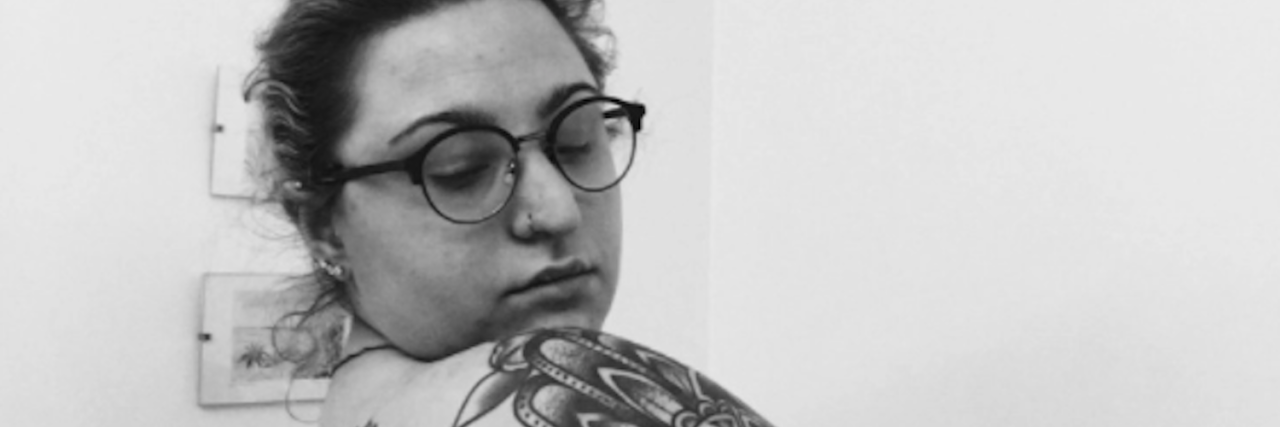 How I'm Learning to Love Myself in Binge Eating Disorder Recovery woman looking over shoulder