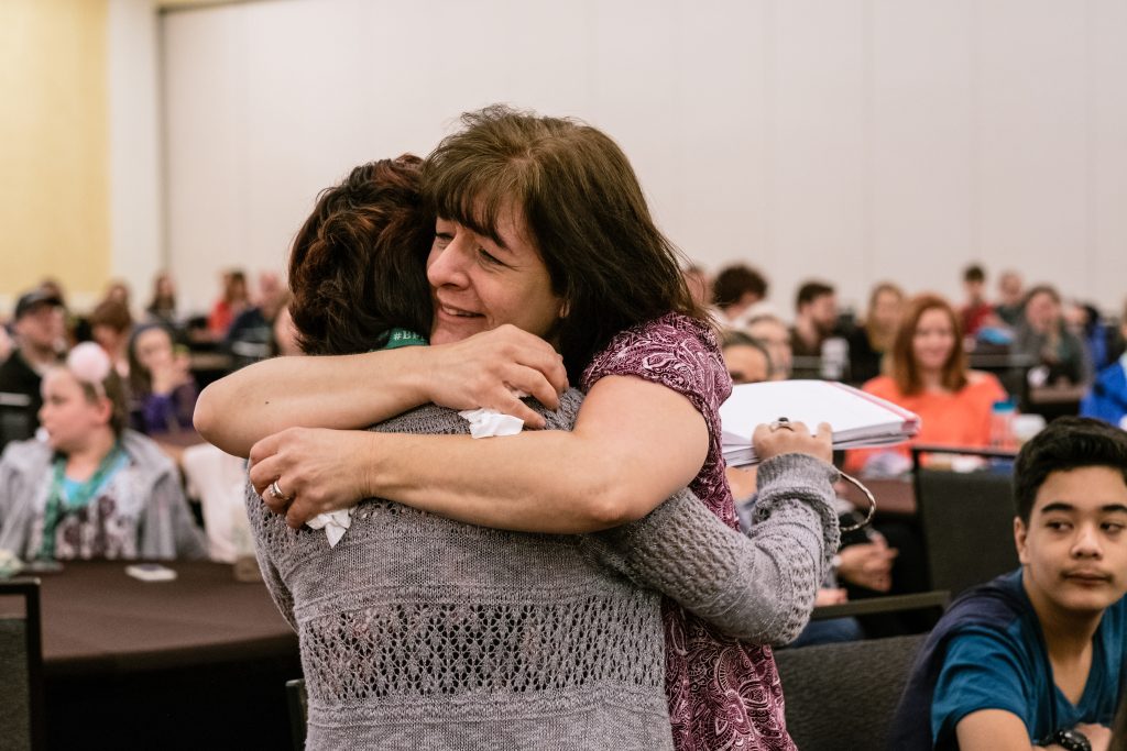 Embracing in tears, after I gave my speech at the 2017 TLC Conference - mother and daughter embracing in tears