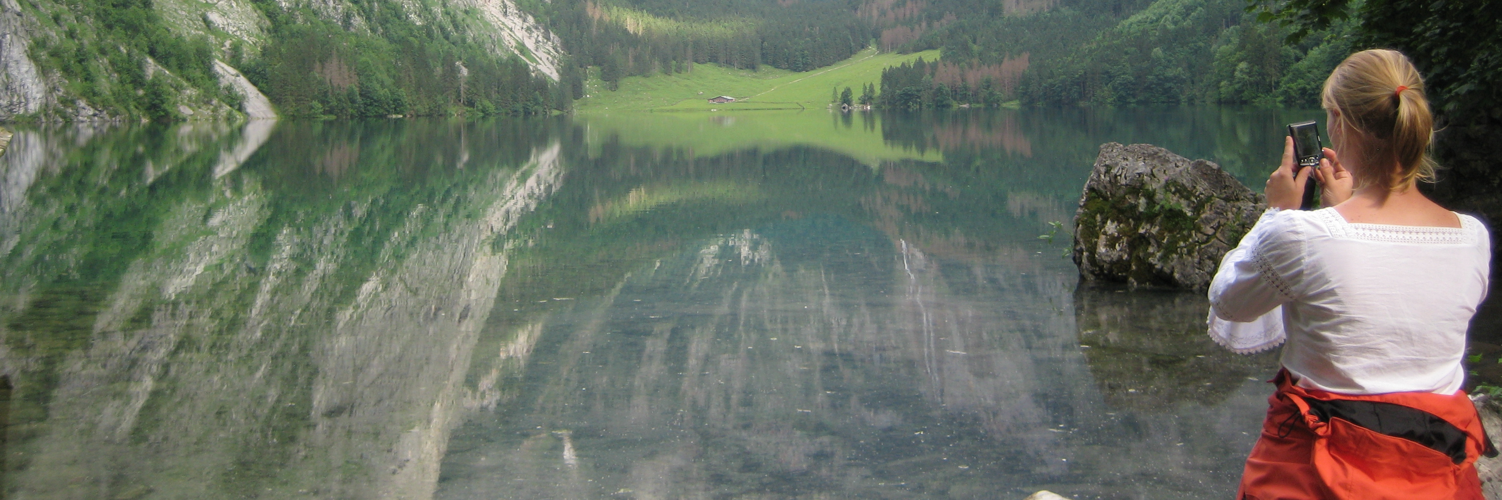 Woman looking towards a mountain.