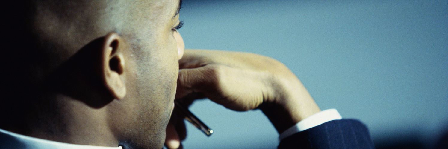 What Autism Advocacy Means to Me: My ABCs of Autism Advocacy side portrait of businessman with hand resting in front of mouth, deep in thought