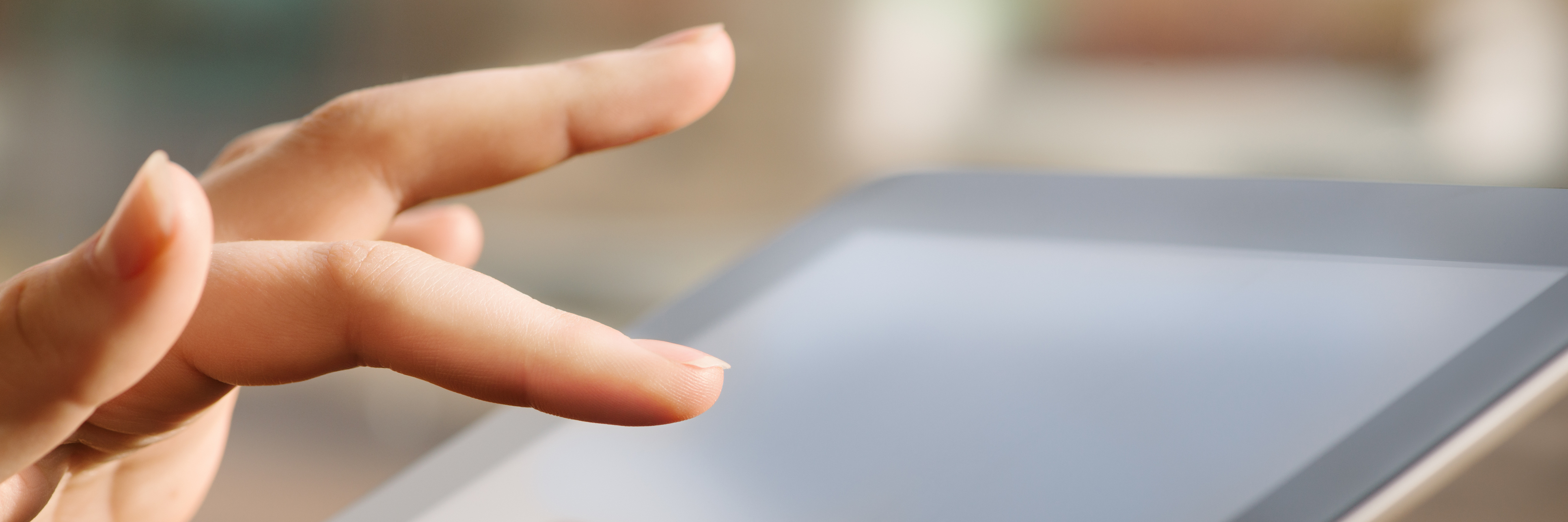 Becoming a Counselor With Cerebral Palsy and an AAC Device Woman holding a tablet computer.