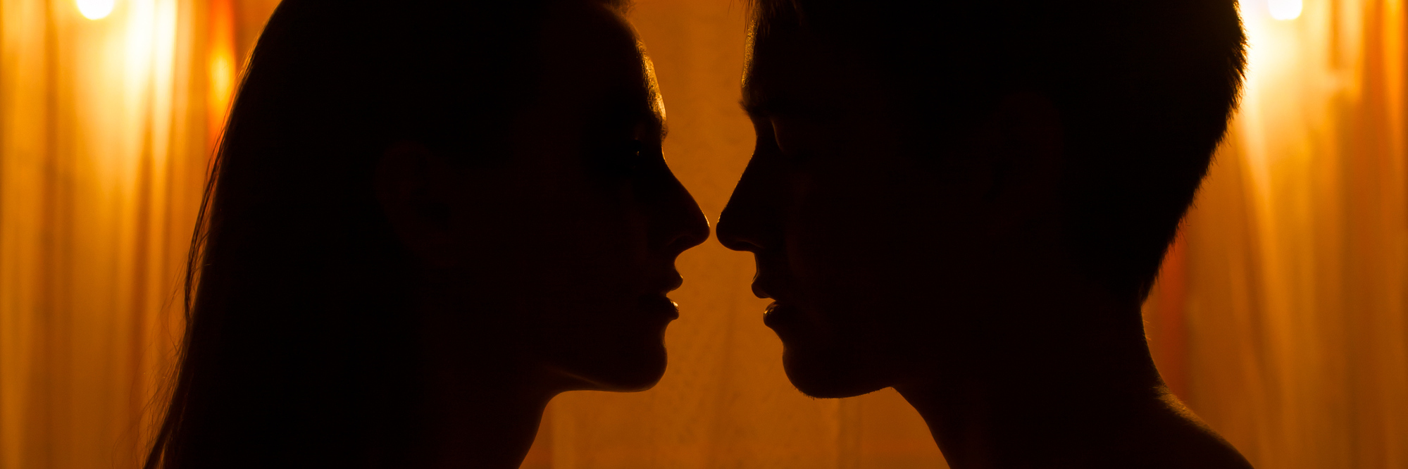 How My Partner Reacted When I Had a Flashback While We Were Having Sex Couple share a moment of romantic affection.