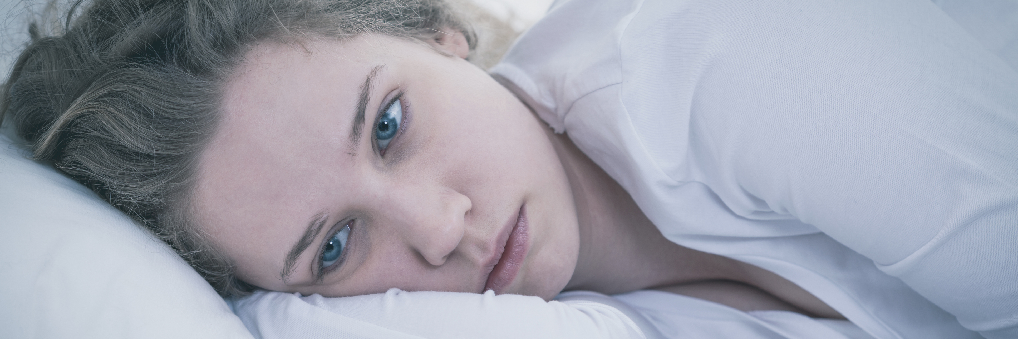 When You Want to Communicate Your Depression but Don't Know How close up of woman lying in bed sad and depressed