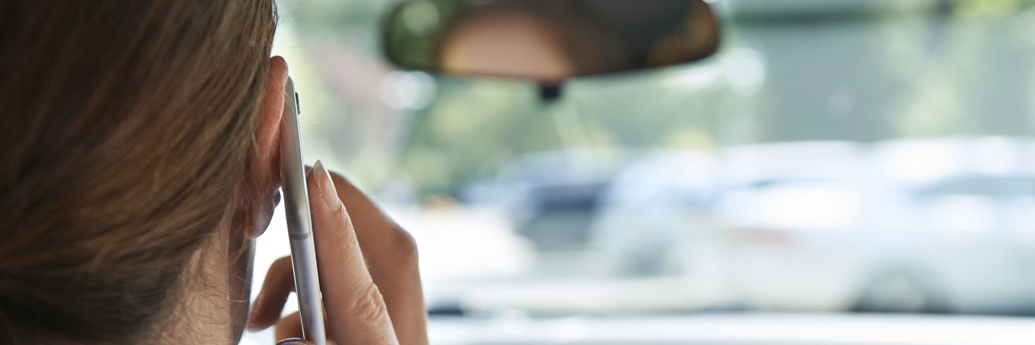 Why I'm Thankful I Kept My Promise to Reach Out woman talking on phone while in car driving