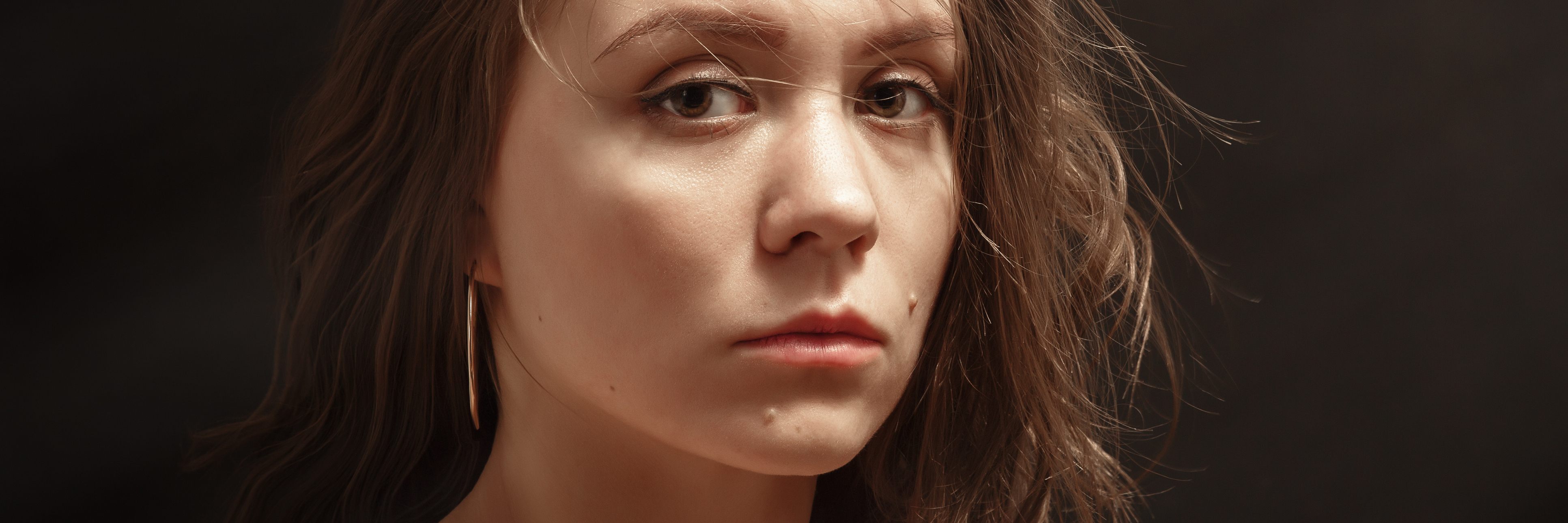 The Silence of Depression: My Metaphor for the Nothingness sad girl on black background looking into camera