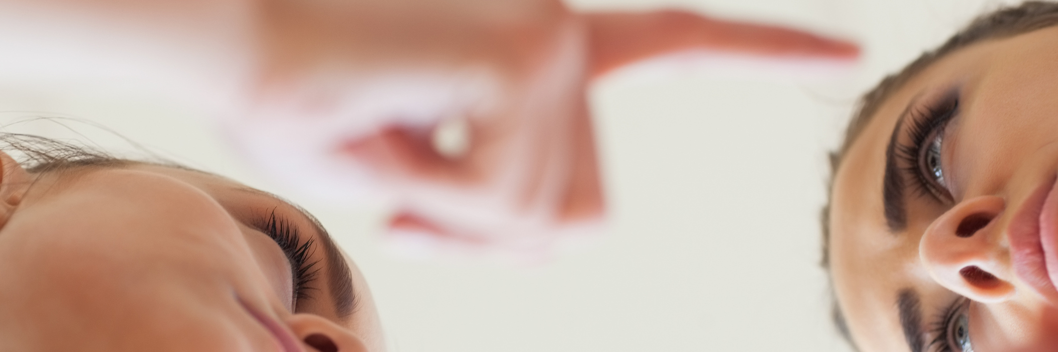 Importance of Not Gaslighting in Chronic Illness Community two women pointing fingers at each other in blame