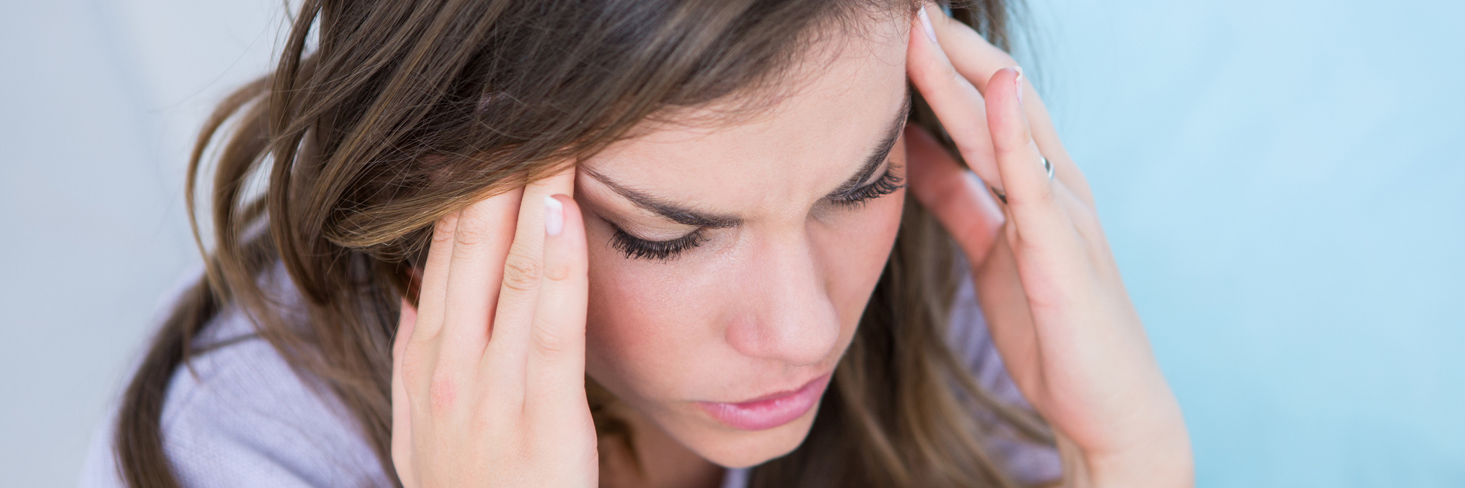 Why Vocalizing Your Doubts About Your Loved One's Illness is Hurtful Woman with a migraine.