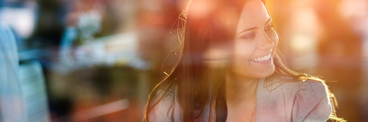 When Your Automatic Smiles Hide the Depression Underneath double exposure of smiling woman sitting in cafe