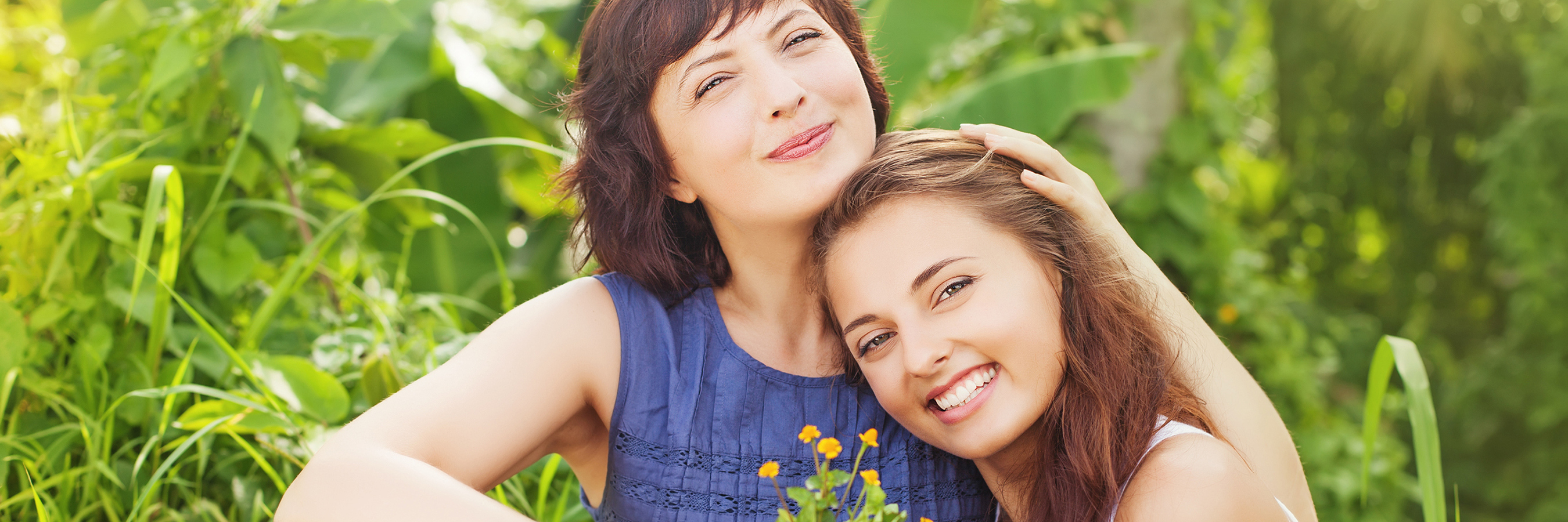 Having Digital Ulcers and Hand Surgery Due to Scleroderma aunt and niece sitting in a garden and hugging each other