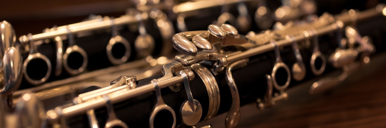 Mental Health Stigma and My High School Clarinet Teacher close up on clarinet in dark rich colors