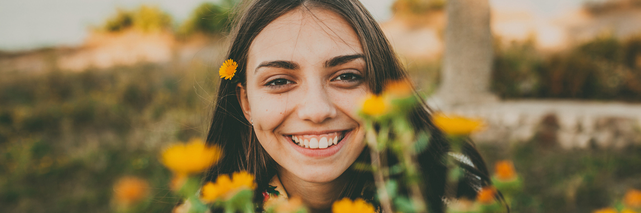 To the Ones Without Drastic Eating Disorder Before and After Photos A girl with flowers in her hair
