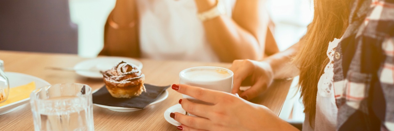 How I Told My Best Friend About Having an Anxiety Disorder Two young and beautiful women meet at the bar for a cappuccino and to chat. A woman speaks while the other is drinking
