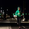 Woman jogging at night.