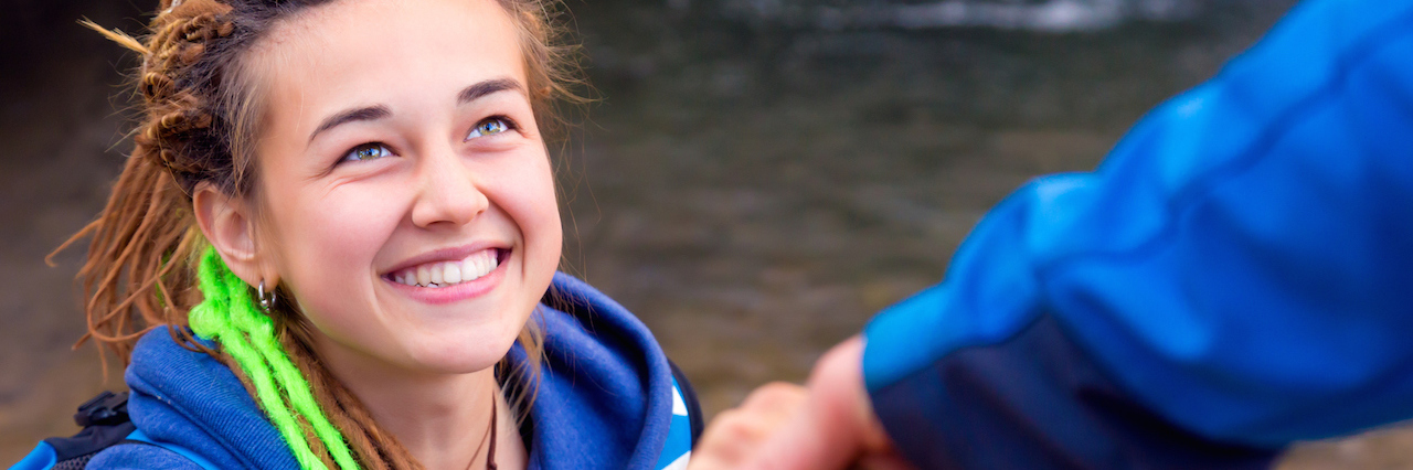 Ways to Support Someone With Mental Illness Someone helping someone up