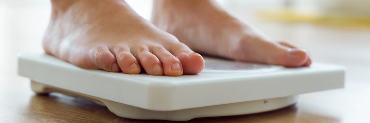 Being Overweight or Fat Doesn't Invalidate My Eating Disorder woman's feet on scale