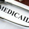 Paper that says Medicaid with a stethoscope over it