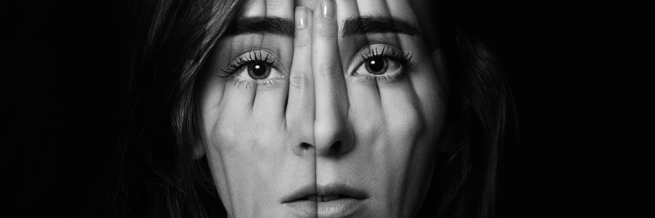 Why I Find Functioning Labels Problematic as an Autistic Person Young girl covering face and eyes with her hands.