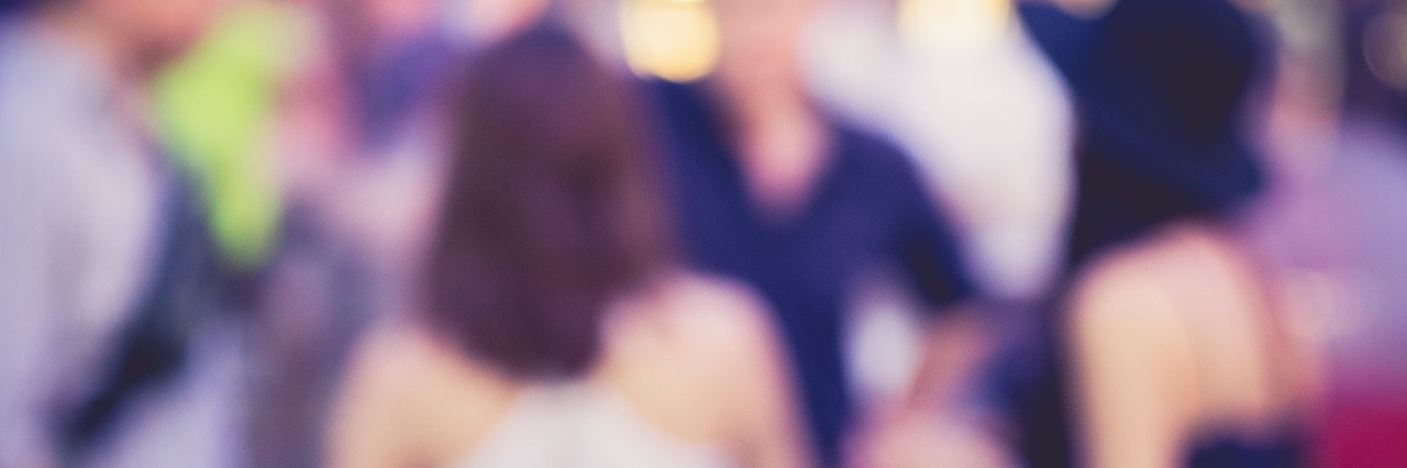 Feeling Isolated With Ehlers-Danlos Syndrome blurred photo of friends at a party