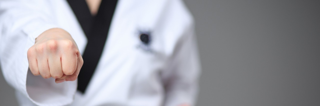 Fibromyalgia, Migraines: Not Giving 110 Percent Due to Illness woman practicing martial arts