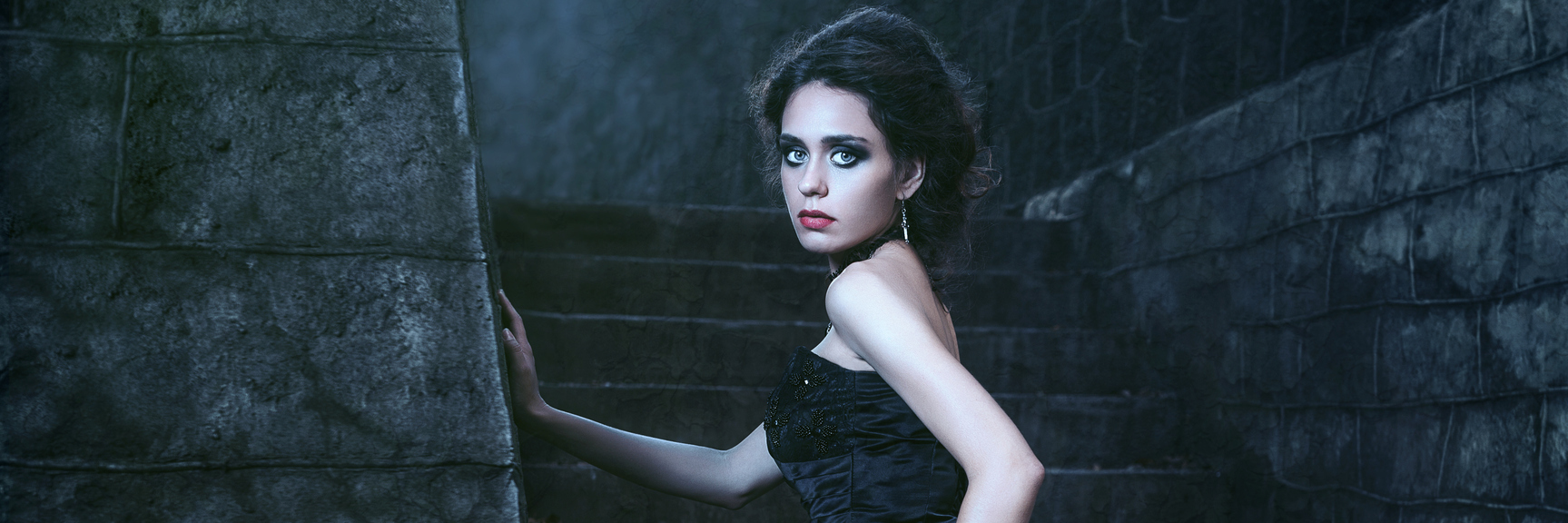 How the Sun Affects My Skin Because of Lupus A woman stands in the dark.