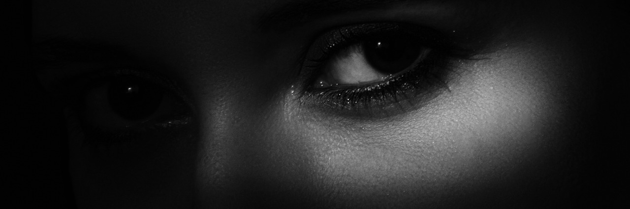 What It's Like Having a Membership to the ‘You Don’t Look Sick’ Club Woman's face with shadow covering it.