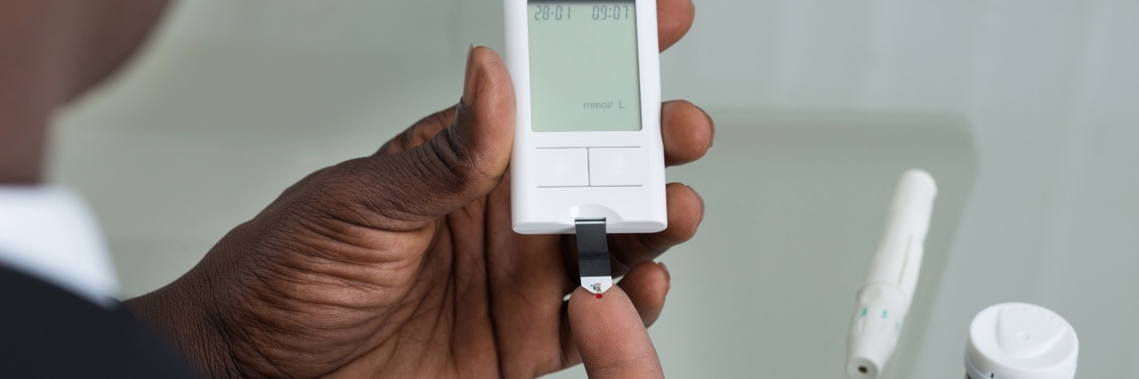 Diabetic patient testing blood sugar.