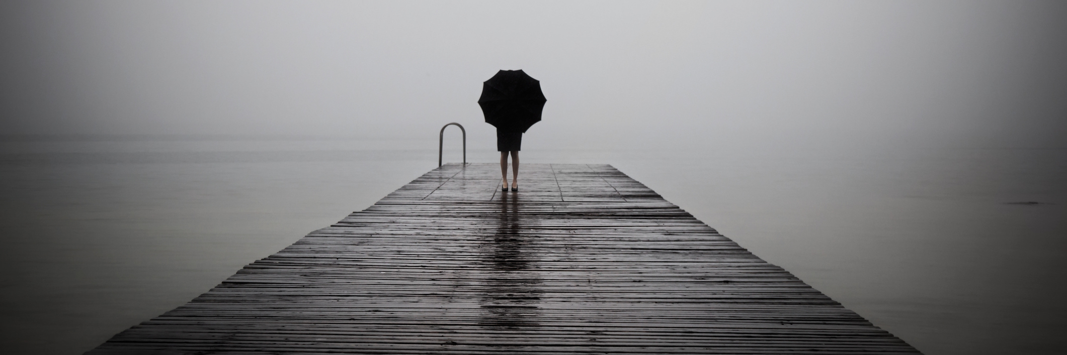 Why It's OK to Not Be Strong All the Time When You're Sick elegant woman dressed in black hiding with umbrella in a misty landscape