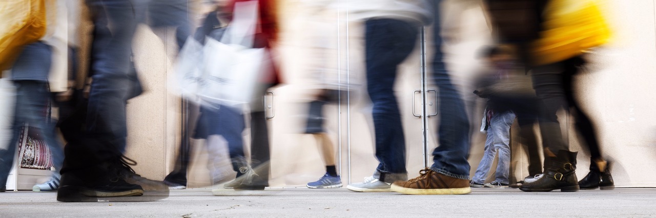 Meniere's Disease, Vertigo: Mental and Physical Symptoms blurred motion of people walking down the street