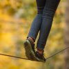 woman walking on a tightrope