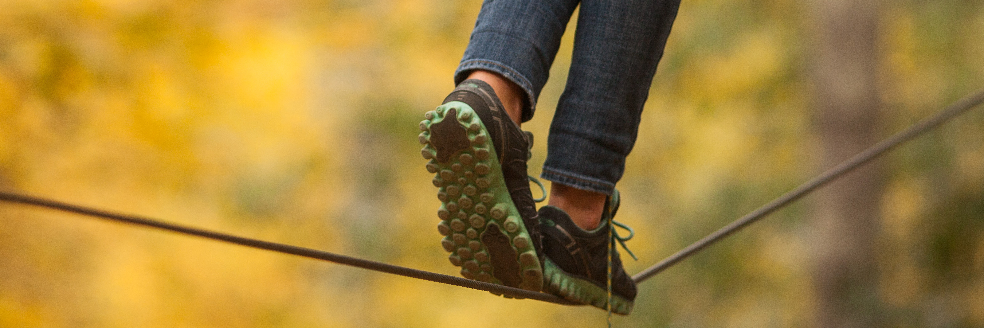 woman walking on a tightrope