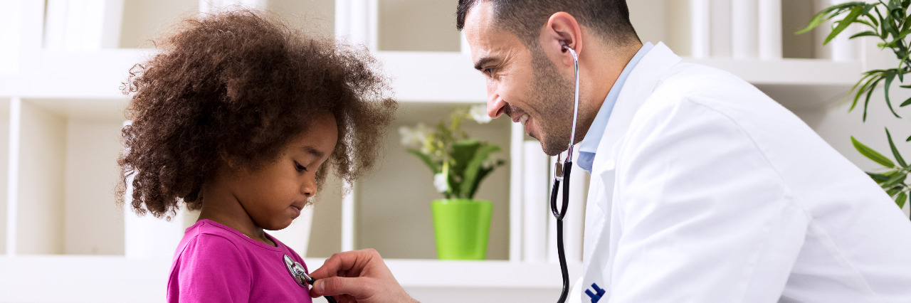 Repealing the ACA Would Harm Children With Medical Needs Pediatrician listening to girl's heart.